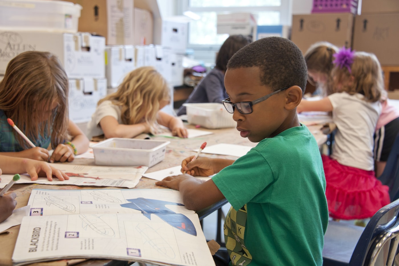 Young children learning together in a classroom